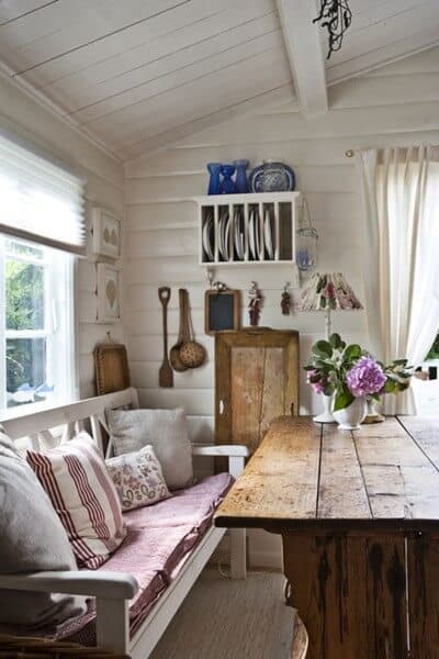 I love everything it this image including the decor on the wall, the table, and bench by the window although the cushions would not work with little children. We could do the bench without cushions and when the kids get older add the cushions. 